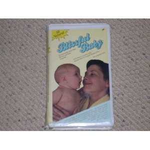   . Includes booklet and fold out baby massage poster. 