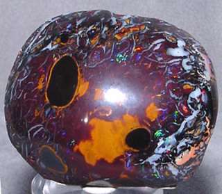  flashes of brilliant rainbow Opal create fiery streams streaking 