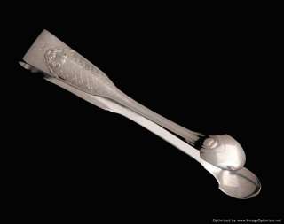 serving spoon the cake pie serving knife and sugar tongs